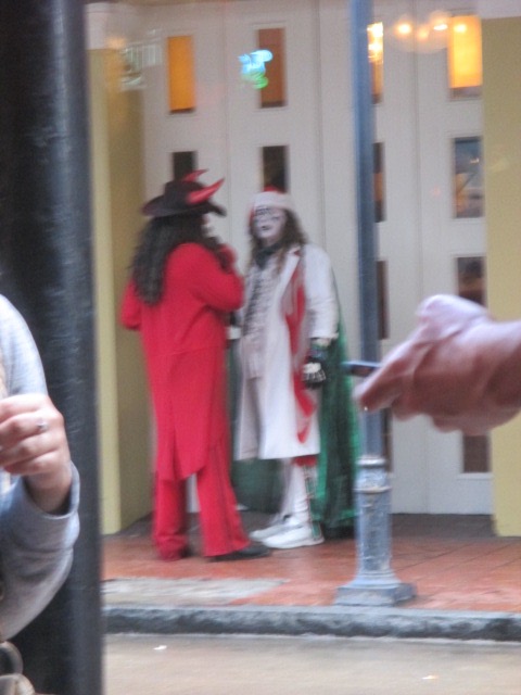 Father Christmas and the Devil seen from the window of ACME Oyster House