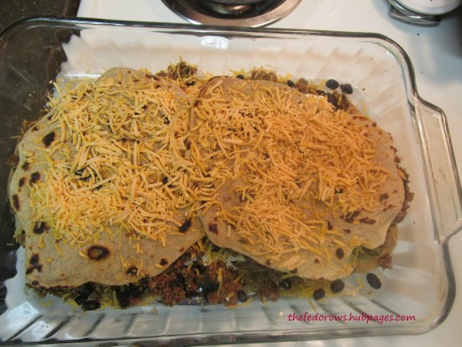 Repeat once more and top with tortillas and cheese.  