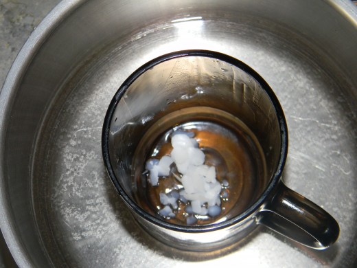 Put the jar in the pot of water