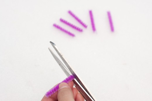 Cut 1 of the purple pipe cleaners into 6 pieces.  Each piece should be about 1.2 inches...get your ruler to measure!