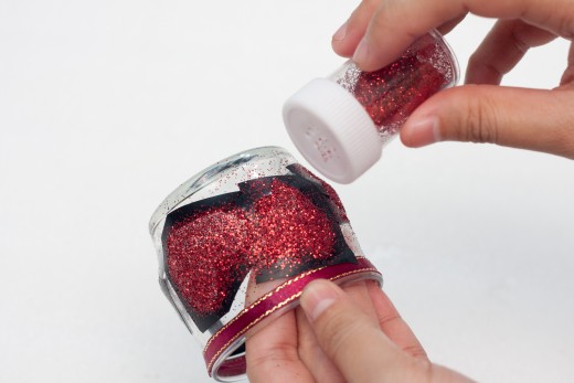 Be generous when you sprinkle the glitter over the wet glue.  Do this step on top of a plate or piece of paper to prevent glitter from spilling all over