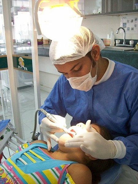 A dentist working on a patient