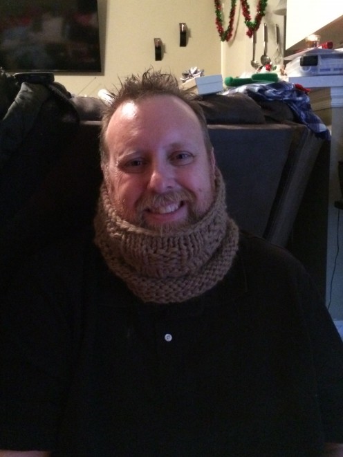 My husband modeling his Christmas cowl made in baby grande alpha yarn!