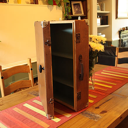 Wall cabinet made with wooden French suitcase