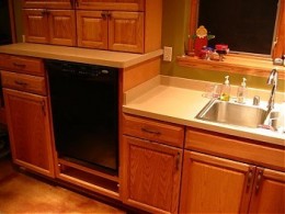 The combination of a raised dishwasher and lowered sink significantly reduces back strain.
