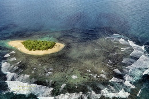 Sea waves create a mandala pattern at Bonbonon Islet, Britania, Surigao del Sur