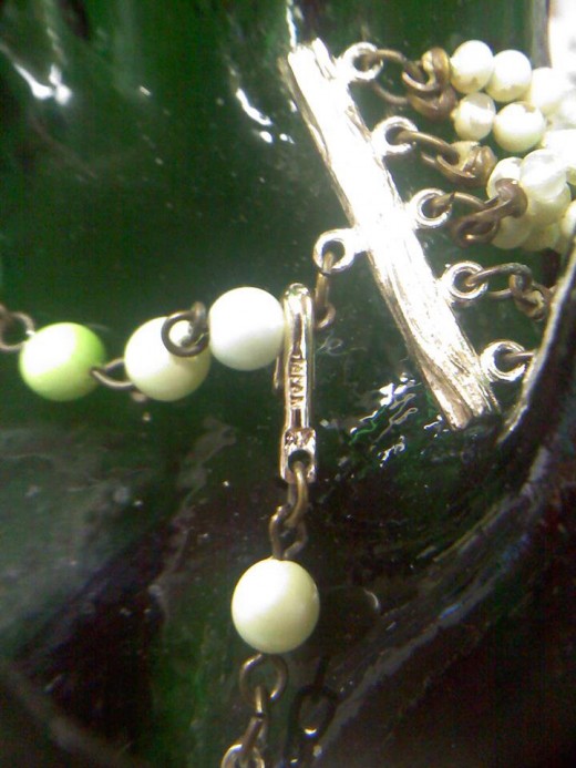 A Blurry Image of the Marking on the Necklace in the Jewelry Set Above.  This photo goes with number two of the above section.