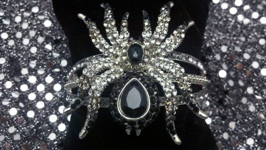 Spiders, moons, stars, black beads, all look like witch jewelry on Halloween