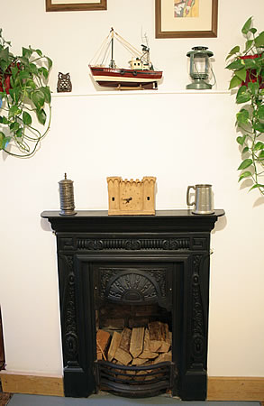 Log storage in fireplace