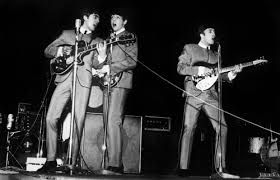 The classic Beatle position  on stage