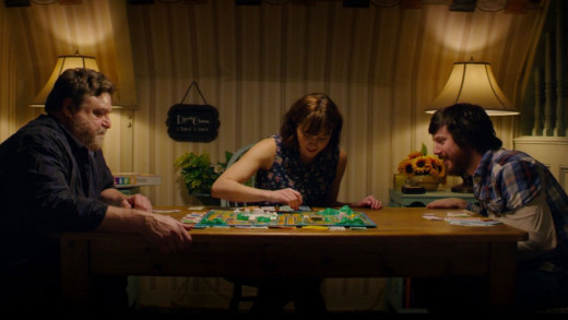 The group playing a board game to pass the time