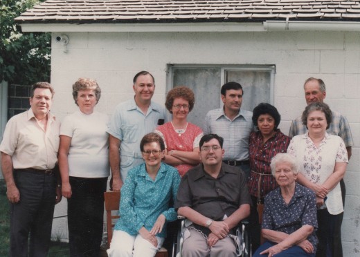 Grandmother with her children and their spouses in the back of her home in Fairview, Utah