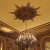 One of the decadent chandeliers with fantastic craftsmanship and "graffito," etched into the walls. The ballroom "showcases 20 medallions of history's most acclaimed women, including Cleopatra, Helen of Troy, Pocahontas, and Madame du Barry."   