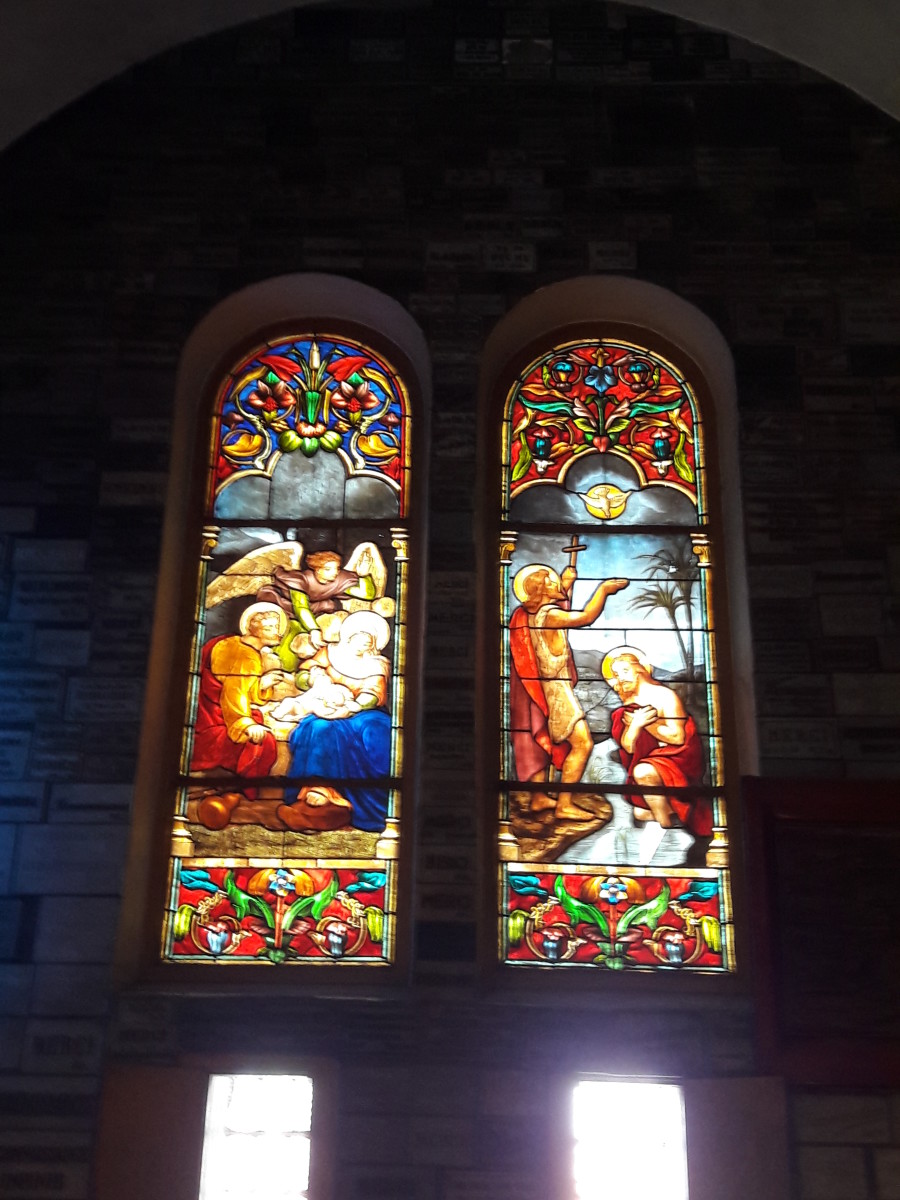 Colorful glass windows are telling such a holy tale