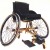 This type of wheelchair would be used to play wheelchair tennis. Note the three wheel design improves maneuverability.