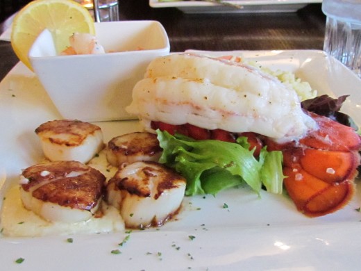 My dinner included the amazing Seafood Platter with pan seared scallops, a lobster tail, tiger shrimps, rice pilaf and a medley of vegetables.