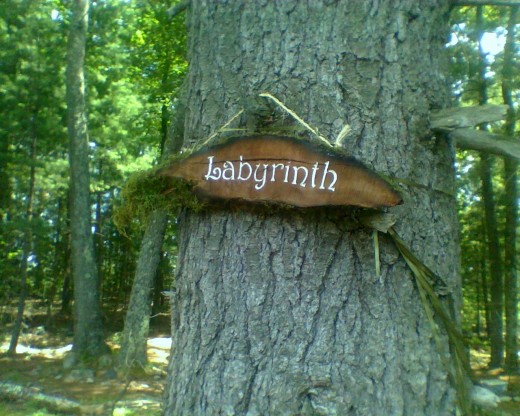 Sign at the entrance to my co-housing community's labyrinth, with a Baltic Wheel design