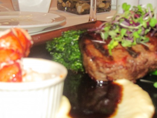 Surf and turf, with lobster, steak, potatoes  vegetables and a delicious sauce which my sister feasted on.   