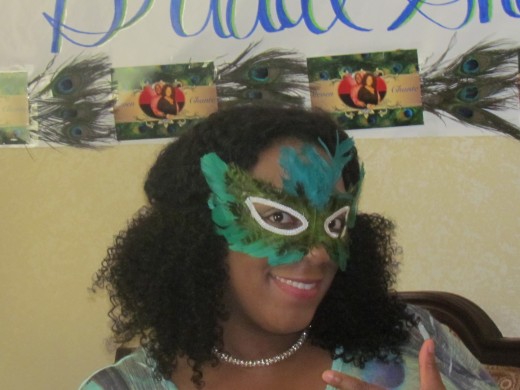 My daughter Chante, wore a mask made of peacock feathers which is her favorite.