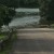 Standing on a hill overlooking the R to the lower level parking/ picnic area. The road and parking area are completely covered by rising waters.