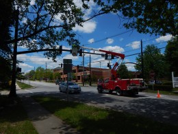 City crews recently removed signage from the traffic light arms.