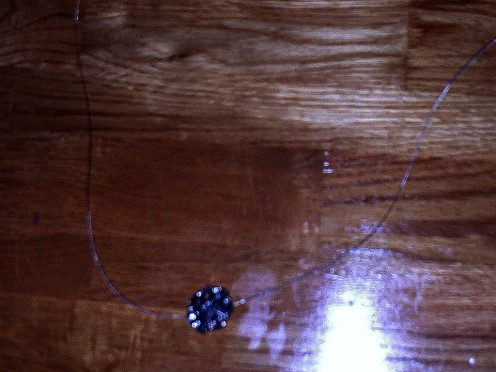 Slip the flower button on to the beading wire.