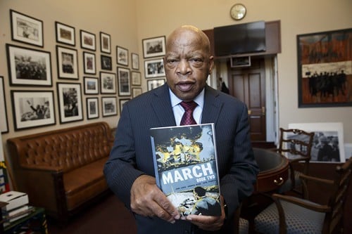 Congressman John Lewis holds a copy of March, Book 2, the second volume of his graphic memoir of his years as a civil rights activist.