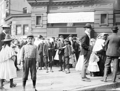 Newsboys stand outside the Armory at 7th and Wabash before Volunteers of America Picnic on June 26, 1902.