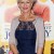 Gorgeous shorter hairstyle and the dress is a deep blue she favors. Gorgeous shorter hairstyle and the dress is a deep blue she favors.