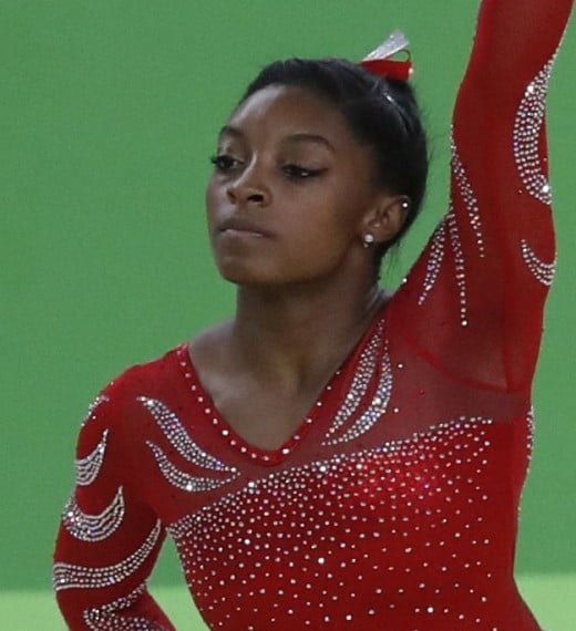Simon Biles is the first African-American to be world all-around champion. She is the first woman to win three consecutive world all-around titles. Biles is the most decorated American female gymnast in World Championships history.