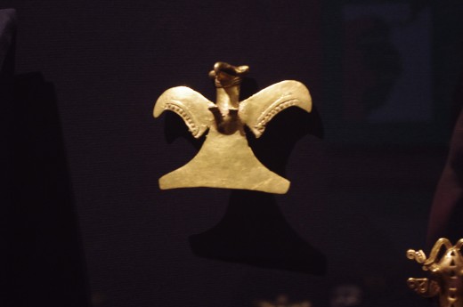 "Bird Pendant" Veraguas style. Made with gold alloy. Yeah that's pretty much what they have for this piece. See this is our tax money when you select "give money to The Walters Art Museum" at voting time.