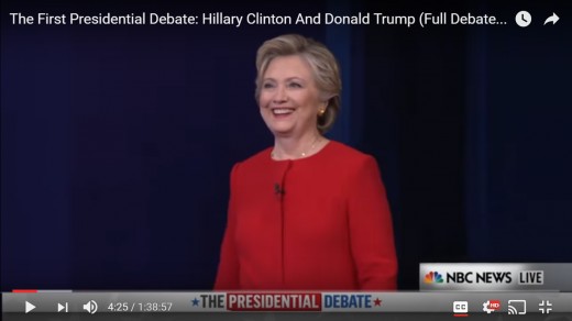 The camera zooms in on HRC, we do not see DJT in this frame.  HRC has her head positioned upward; she gazes to the opposite side of the stage.