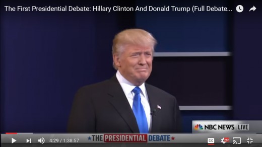 DJT turns his head toward the approaching HRC.  His head remains erect. 