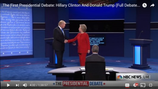 DJT reaches left arm behind HRC's back. Distance between the two begins to narrow. DJT's body remains square; HRC's body remains sideways.