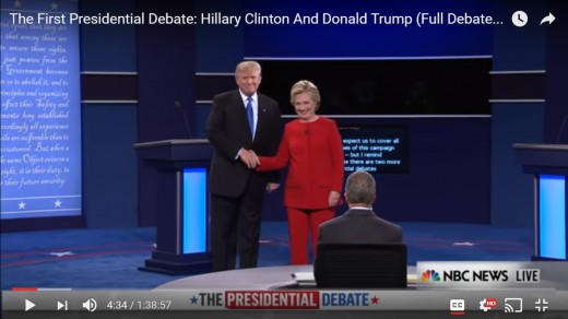 DJT opens hand from shake first. Both candidates remain for a moment in photo op position, facing the audience squarely.