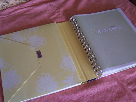 Envelope holds pattern pieces, while spiral binding allows pages to lay flat.