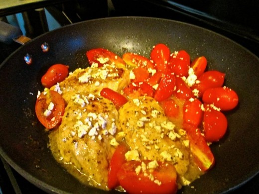 Sprinkle crumbled Tomato Basil Feta Cheese over the Chicken and Tomatoes.