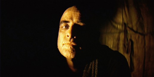 Kurtz depicted with the composer's manipulation of light and shadow. 