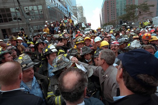 President Bush greets first  responders and crowds who  came to help after te 911 terrorist  attack on The Twin Towers