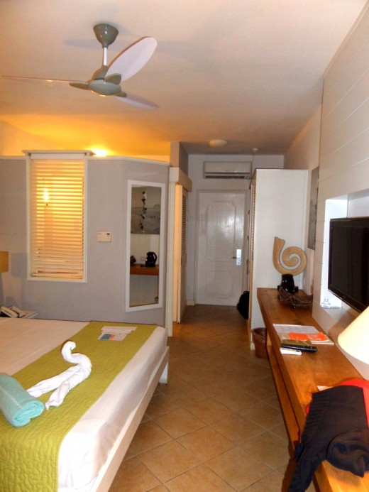 Section over bathroom has an open ceiling except for the toilet. It is enclosed.
