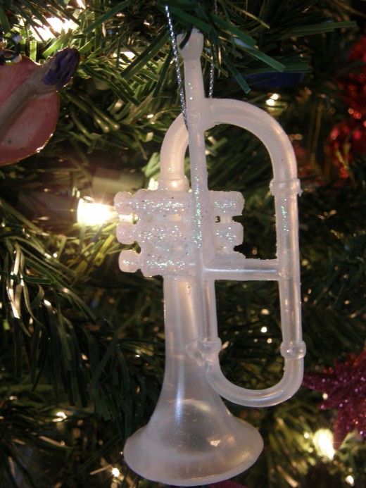 Trumpet ornament. The author used to play the trumpet in the High School band as well as a marching band.  She still owns a trumpet, although does not play anymore.