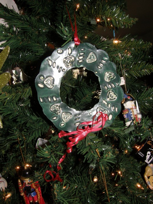 An ornament made by my oldest son when he was in Kindergarten.  There were macaroni pieces on the original, but they have since fallen off to leave some beautiful impressions.