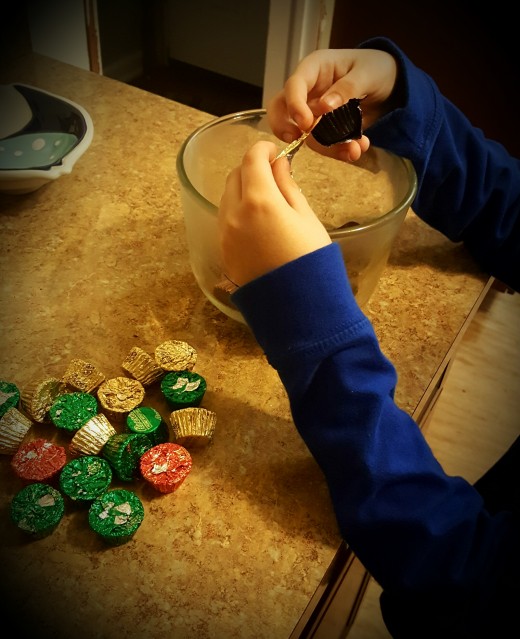 My son unwrapping the chocolates.