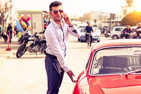 With phone in hand  the smooth operator  always has another girl  on the line