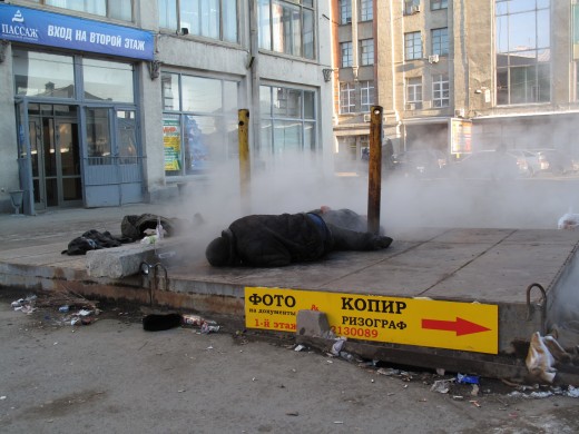 A Homeless Person sleeping in the open