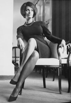 Sophia Loren rocking a sleek shift and statement necklace. 