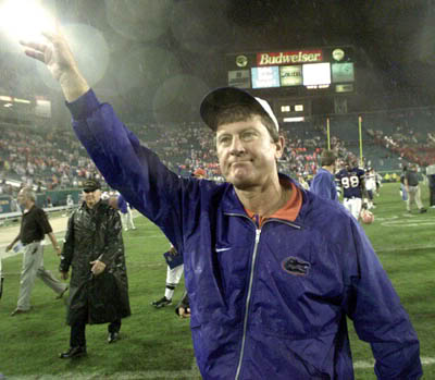 Then-Florida Gators head coach, Steve Spurrier waves to Gators fans as he leaves The Swamp after another victory by The Gators