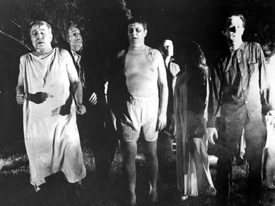 Zombies stalking the countryside in Night of The Living Dead