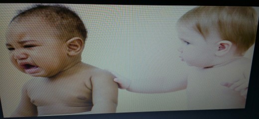 The baby caring for another that is crying. Even a baby has compassion. 
