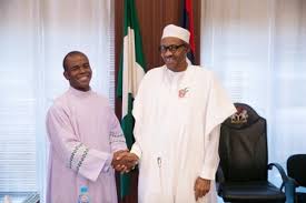 Fr. Mbaka in a warm handshake with Nigeria's President Muhammadu Buhari.